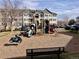 Community playground with various equipment near a multi-story apartment building at 15700 E Jamison Dr # 3-202, Englewood, CO 80112