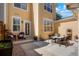 Private back patio area perfect for outdoor dining and relaxation with string lights overhead at 8427 E 35Th Ave, Denver, CO 80238