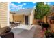 Backyard features a patio with a dining table, a garage, and a garden area for outdoor enjoyment at 8427 E 35Th Ave, Denver, CO 80238