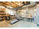 Unfinished basement features utilities and storage at 8427 E 35Th Ave, Denver, CO 80238