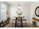 Cozy dining area featuring a round table with seating and stylish decor at 8427 E 35Th Ave, Denver, CO 80238