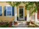 Inviting front entrance with a decorative door and potted plants with prominent house number at 8427 E 35Th Ave, Denver, CO 80238