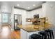 Spacious kitchen with stainless steel appliances, a large island, and breakfast bar seating at 8427 E 35Th Ave, Denver, CO 80238