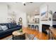 Bright living room open to the dining area and kitchen, perfect for entertaining at 8427 E 35Th Ave, Denver, CO 80238
