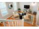 Bright and open loft area with hardwood floors, perfect for a reading nook or home office at 8427 E 35Th Ave, Denver, CO 80238