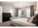 Elegantly appointed main bedroom with a cathedral ceiling and en-suite bathroom at 8427 E 35Th Ave, Denver, CO 80238