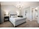 Spacious main bedroom features a chandelier, large windows, and a walk-in closet at 8427 E 35Th Ave, Denver, CO 80238