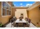 Cozy patio area for entertaining with a tile table and chair set at 8427 E 35Th Ave, Denver, CO 80238