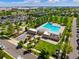 Aerial view of community pool with well-maintained landscaping and surrounding neighborhood homes at 8427 E 35Th Ave, Denver, CO 80238