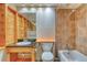 Bathroom featuring wood accents, vanity and a tiled shower-tub combo at 3351 S Field St # 191, Lakewood, CO 80227