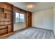 This bedroom offers built-in shelving and a large window providing plenty of natural light at 3351 S Field St # 191, Lakewood, CO 80227