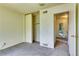 Bedroom featuring closet and entryway at 3351 S Field St # 191, Lakewood, CO 80227