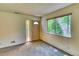Inviting living room featuring a decorative front door and natural light from the window at 3351 S Field St # 191, Lakewood, CO 80227