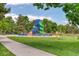 Community playground with benches and lush green grass at 3351 S Field St # 191, Lakewood, CO 80227