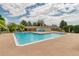Outdoor community pool featuring lounge chairs and a bath house at 3351 S Field St # 191, Lakewood, CO 80227