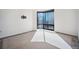 Bright bedroom with large window, TV mount, and neutral carpet at 1625 Larimer St # 3004, Denver, CO 80202