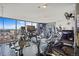 Spacious gym with various cardio machines and floor-to-ceiling windows overlooking city at 1625 Larimer St # 3004, Denver, CO 80202