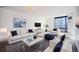 Bright living room featuring plush seating, modern décor, and expansive windows with city views at 1625 Larimer St # 3004, Denver, CO 80202