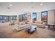 Bright living room with large windows, comfortable seating, and city views at 1625 Larimer St # 3004, Denver, CO 80202