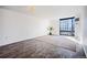 Spacious living room with sleek wood floors and large windows offering city views at 1625 Larimer St # 3004, Denver, CO 80202
