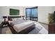 Modern main bedroom with large windows offering city views and a stylish, comfortable layout at 1625 Larimer St # 3004, Denver, CO 80202