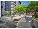 Outdoor kitchen with stainless steel grills and stone countertops for convenient entertaining at 1625 Larimer St # 3004, Denver, CO 80202