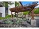Outdoor lounge area with pergola and comfortable seating offers a relaxing retreat at 1625 Larimer St # 3004, Denver, CO 80202