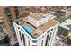 Aerial view of a rooftop pool on a high-rise building, surrounded by lounge chairs at 1625 Larimer St # 3004, Denver, CO 80202