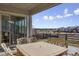 Covered patio with seating area and view of neighborhood at 23542 E Bailey Pl, Aurora, CO 80016