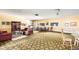 Spacious clubhouse featuring a kitchenette, dining area, and comfortable seating areas at 8822 E Florida Ave # G07, Denver, CO 80247