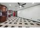 This spacious kitchen features dark wood cabinets, stainless steel appliances, and black and white checkered floors at 8822 E Florida Ave # G07, Denver, CO 80247