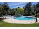 Inviting outdoor community pool, surrounded by mature trees and landscaping at 8822 E Florida Ave # G07, Denver, CO 80247