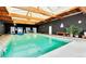 Indoor community swimming pool with skylights providing natural light and a relaxing atmosphere at 8822 E Florida Ave # G07, Denver, CO 80247