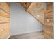 Cozy attic space with wood-paneled walls and ceiling, ideal for a bedroom or office at 7700 E 29Th Ave # 102, Denver, CO 80238