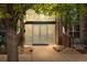 Close up of building entrance with double doors, brick accents and large windows at 7700 E 29Th Ave # 102, Denver, CO 80238