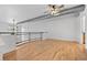 Spacious living room with hardwood floors and large windows, perfect for entertaining guests at 7700 E 29Th Ave # 102, Denver, CO 80238