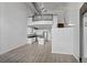 Open-concept home boasts a modern kitchen, dining space, and living room with soaring ceilings at 7700 E 29Th Ave # 102, Denver, CO 80238