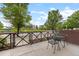 Exterior patio with table and chairs and a view of the neighborhood landscaping at 7700 E 29Th Ave # 102, Denver, CO 80238
