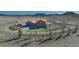 Overhead view of a horse property with a spacious home, paddocks, and outbuildings at 11524 Spruce Mountain Rd, Larkspur, CO 80118