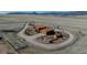 Aerial view of a horse property with barns, paddocks, and a circular driveway at 11524 Spruce Mountain Rd, Larkspur, CO 80118