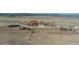 Aerial view of a horse property, complete with a charming residence, paddocks, and outbuildings at 11524 Spruce Mountain Rd, Larkspur, CO 80118
