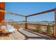 The back porch offers a place to relax and enjoy the view of the land and countryside at 11524 Spruce Mountain Rd, Larkspur, CO 80118