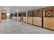Indoor horse stalls boasting wood construction and ample space for livestock at 11524 Spruce Mountain Rd, Larkspur, CO 80118