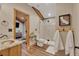 Bathroom with a mosaic tile shower, copper sink, and wood accents, creating a rustic yet modern feel at 11524 Spruce Mountain Rd, Larkspur, CO 80118