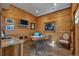 Cozy office features wood paneled walls, tiled floors, and recessed lighting at 11524 Spruce Mountain Rd, Larkspur, CO 80118