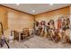 Tack room with wood flooring offering plenty of storage for saddles and riding equipment at 11524 Spruce Mountain Rd, Larkspur, CO 80118