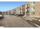 Modern apartment complex with ample parking and well-maintained landscaping for convenient and attractive living at 8475 E 36Th Ave # 337, Denver, CO 80238
