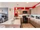 Open kitchen featuring modern appliances, a white quartz countertop, and updated cabinetry at 8475 E 36Th Ave # 337, Denver, CO 80238