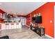 An open kitchen featuring a long breakfast bar, pendants, and modern appliances at 8475 E 36Th Ave # 337, Denver, CO 80238
