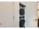 Efficient laundry room with a modern stacked washer and dryer, maximizing space and convenience at 8475 E 36Th Ave # 337, Denver, CO 80238